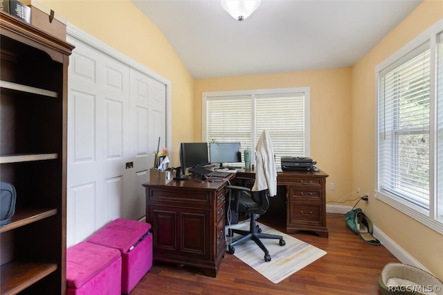 office with dark hardwood / wood-style floors and vaulted ceiling