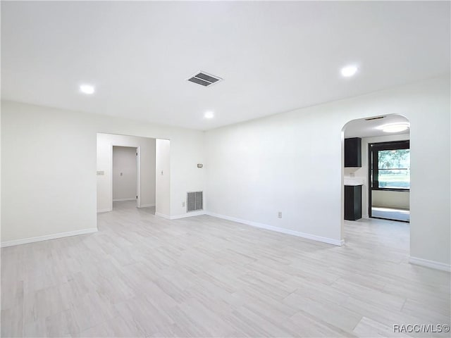 spare room with light wood-type flooring