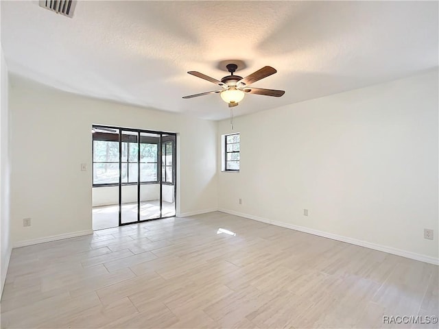 unfurnished room featuring ceiling fan