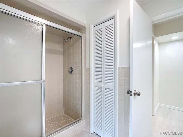 bathroom featuring an enclosed shower