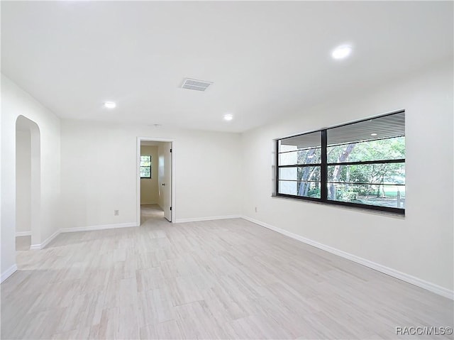 spare room featuring light hardwood / wood-style floors