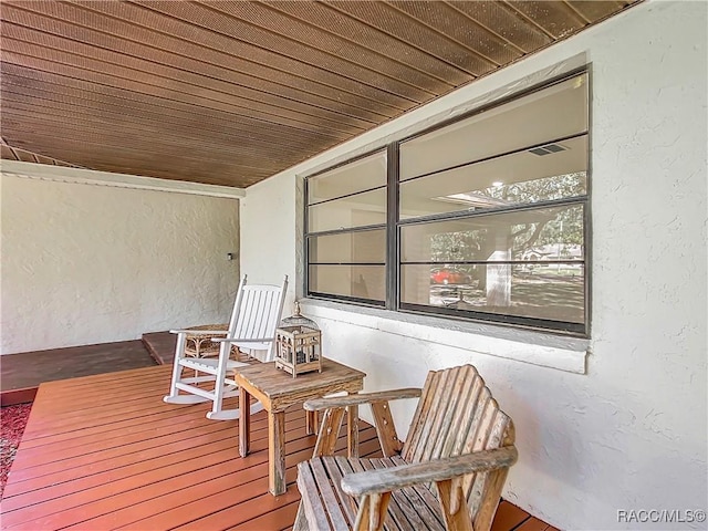 wooden deck featuring a porch