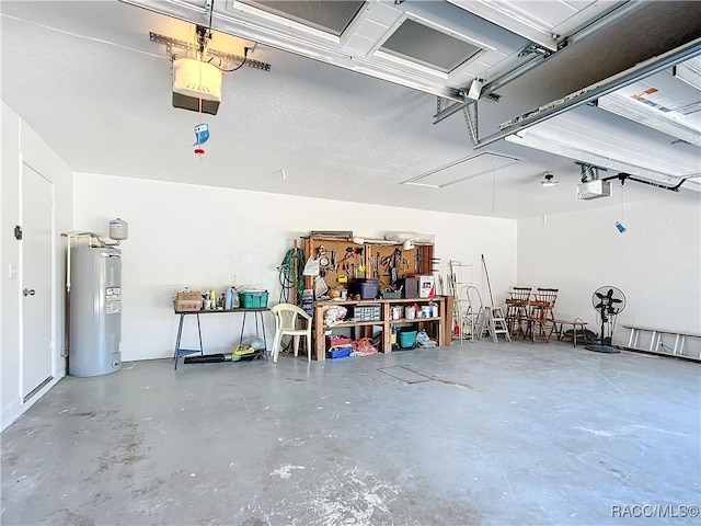 garage with electric water heater and a garage door opener