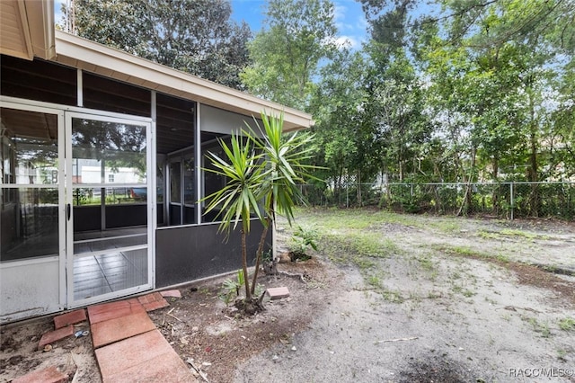 view of yard featuring a sunroom