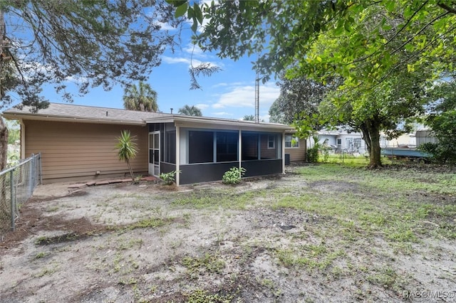 rear view of house with a sunroom