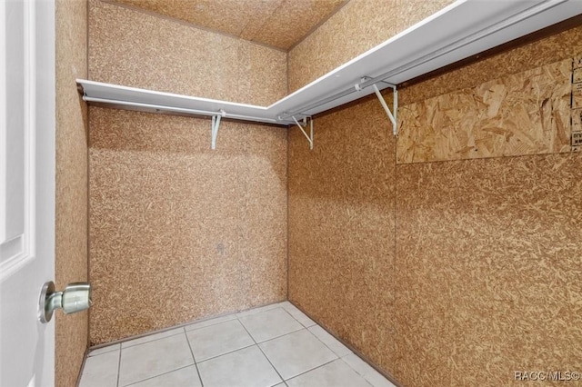 walk in closet featuring tile patterned flooring