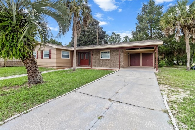 single story home featuring a carport and a front yard