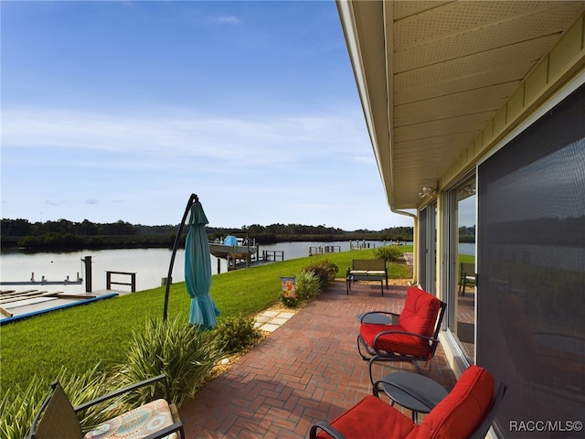 view of patio / terrace featuring a dock and a water view