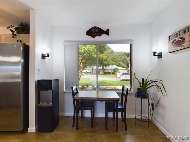 dining space featuring tile patterned flooring