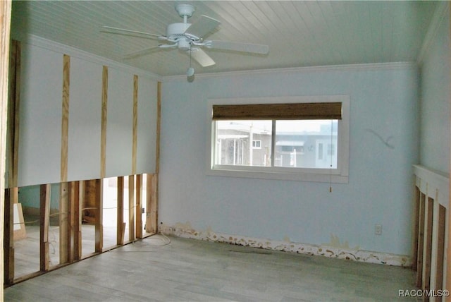 spare room featuring ceiling fan and crown molding