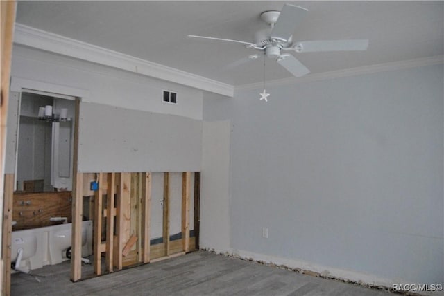 spare room featuring ceiling fan, ornamental molding, and hardwood / wood-style floors