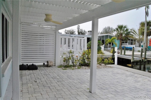 view of patio with ceiling fan and a pergola