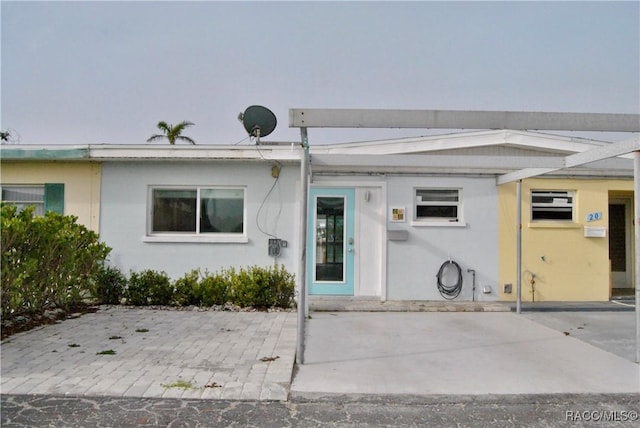 property entrance with a patio area