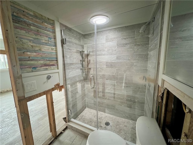 bathroom with toilet and walk in shower