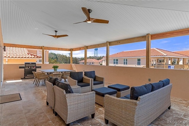 view of patio featuring area for grilling, outdoor lounge area, and ceiling fan