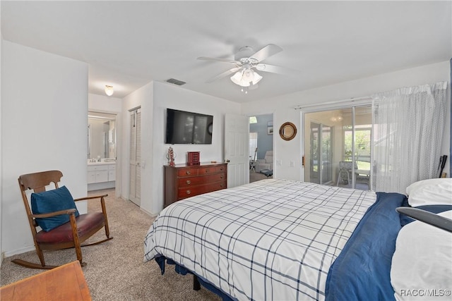 bedroom with access to outside, light colored carpet, ensuite bathroom, visible vents, and a closet