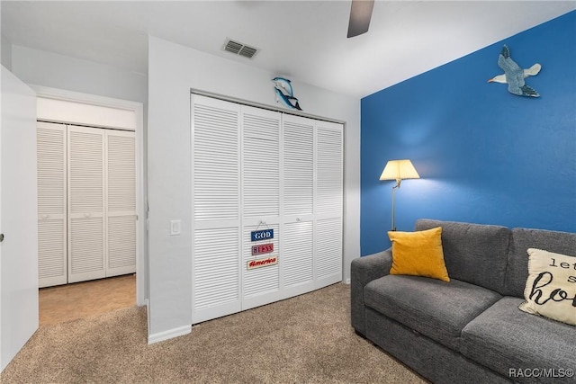 sitting room with visible vents, carpet, ceiling fan, and baseboards