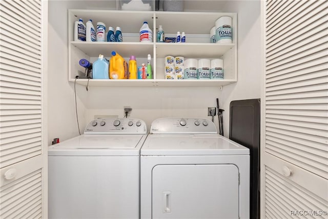 washroom featuring laundry area and washing machine and clothes dryer