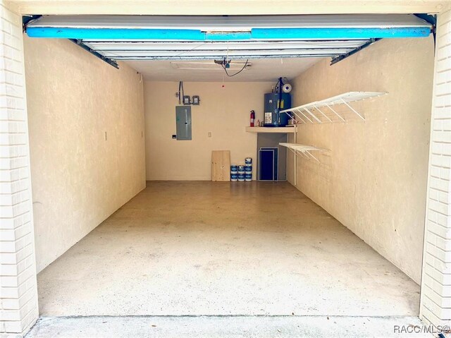 910 W Penn Hills Ct, Beverly Hills, FL 34465 - garage with electric panel and water heater