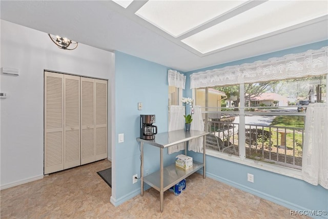 interior space featuring baseboards