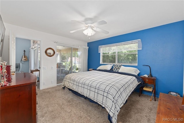 carpeted bedroom with a ceiling fan and access to exterior