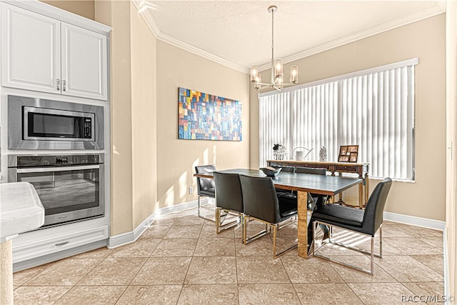 tiled dining area with a textured ceiling, crown molding, and a chandelier