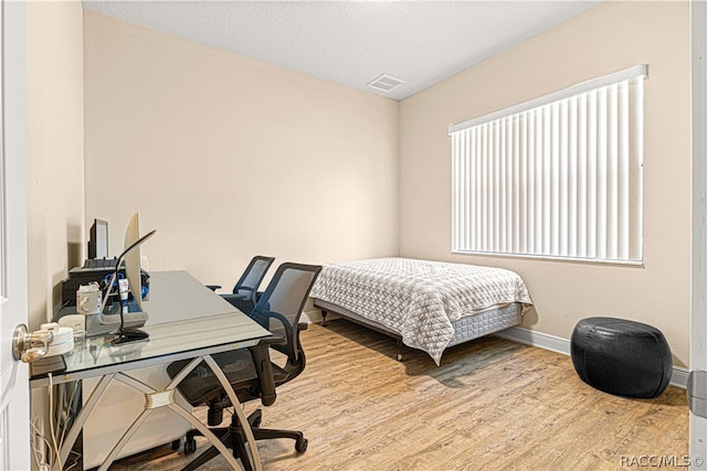 bedroom featuring light hardwood / wood-style flooring