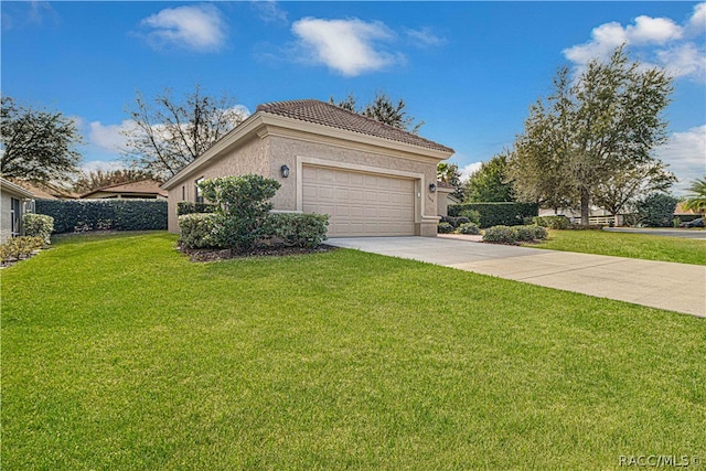 view of home's exterior featuring a yard and a garage