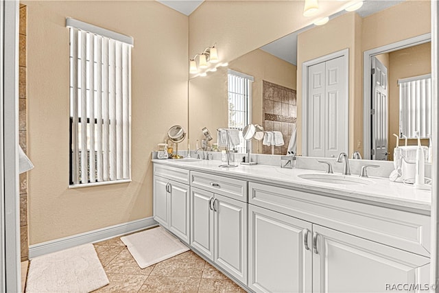 bathroom with tile patterned floors and vanity