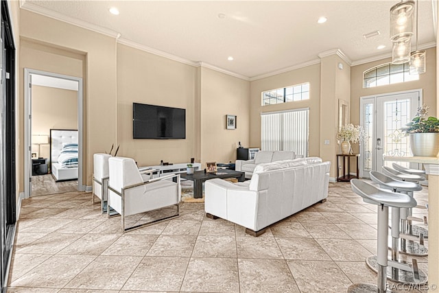 tiled living room featuring a high ceiling and ornamental molding