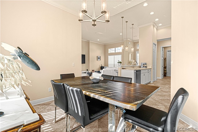 dining room featuring a notable chandelier, sink, and crown molding