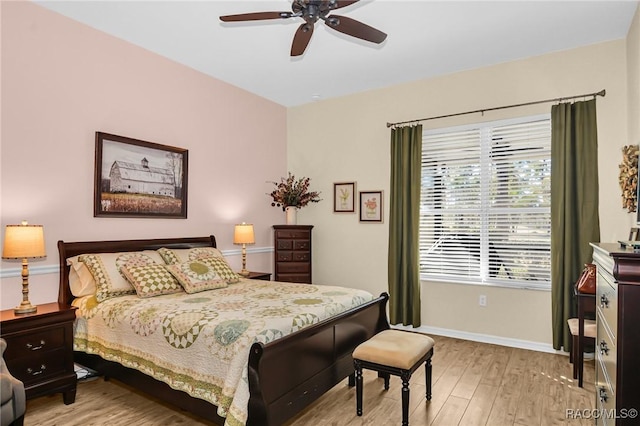 bedroom with ceiling fan and light hardwood / wood-style flooring