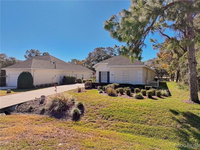 view of side of home with a lawn