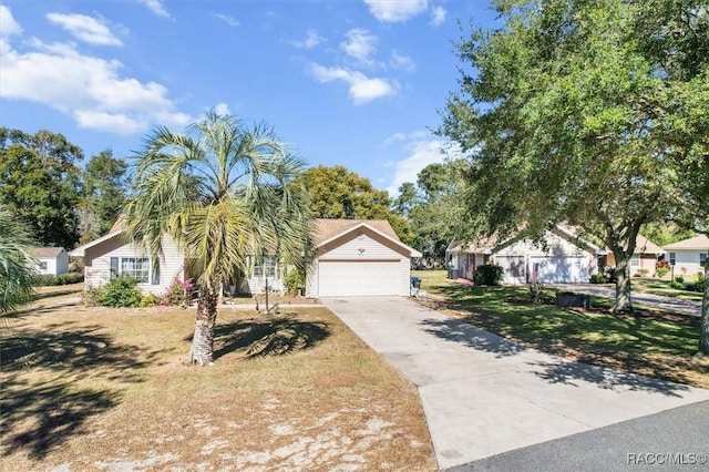 view of front of home with a garage and a front yard