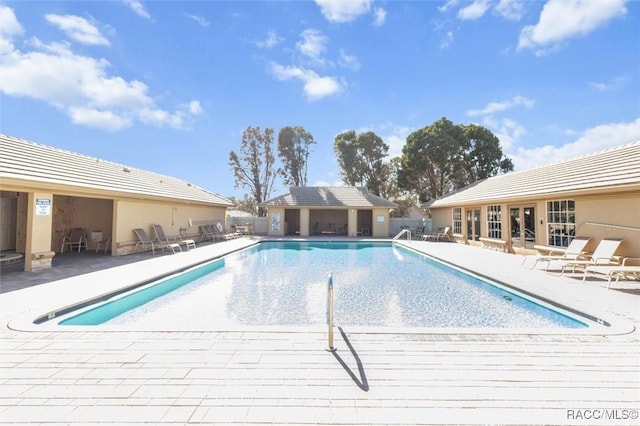 view of pool featuring a patio area