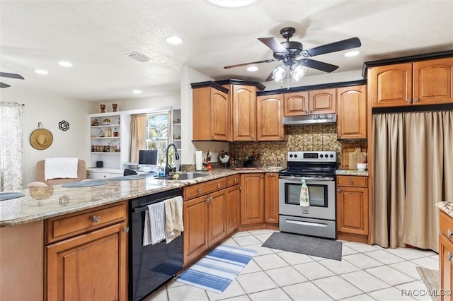 kitchen featuring black dishwasher, sink, stainless steel range with electric cooktop, decorative backsplash, and light stone countertops