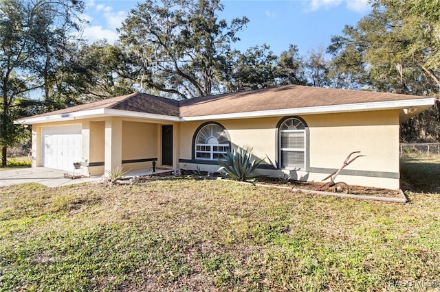 single story home with a garage and a front yard