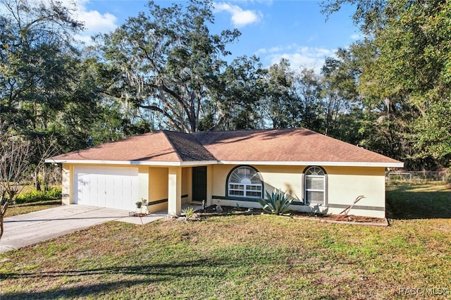 ranch-style home featuring a garage and a front lawn