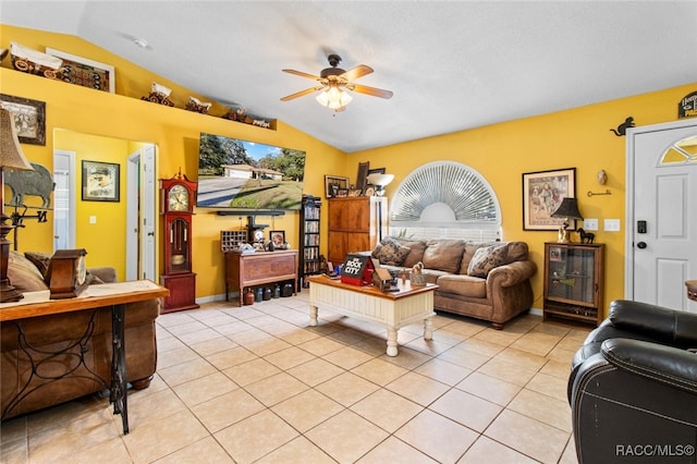 living room featuring light tile patterned floors, vaulted ceiling, and ceiling fan