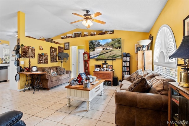 living room featuring vaulted ceiling, light tile patterned floors, and ceiling fan