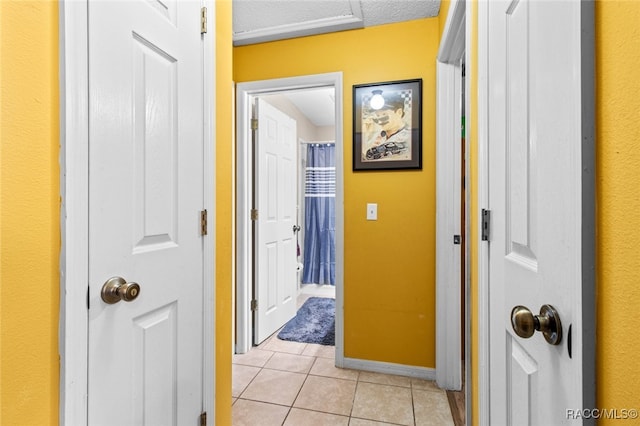 hallway with light tile patterned flooring