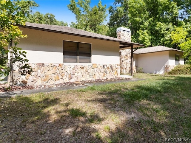 exterior space with a lawn