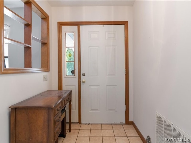 doorway to outside featuring light tile patterned floors