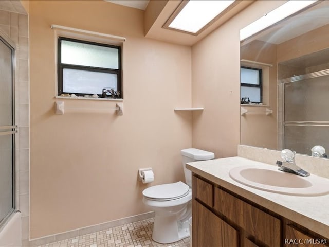 full bathroom featuring tile patterned flooring, vanity, toilet, and combined bath / shower with glass door