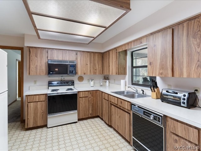 kitchen with sink and black appliances