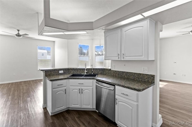 kitchen featuring ceiling fan, dark wood-style floors, a sink, and dishwasher