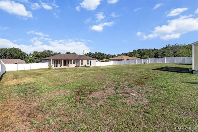 view of yard featuring a fenced backyard