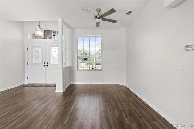 entryway with visible vents, dark wood-style flooring, ceiling fan, and baseboards