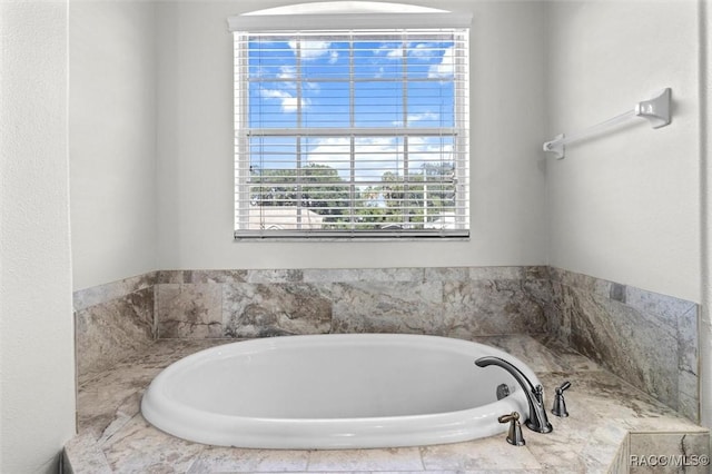 bathroom featuring a garden tub