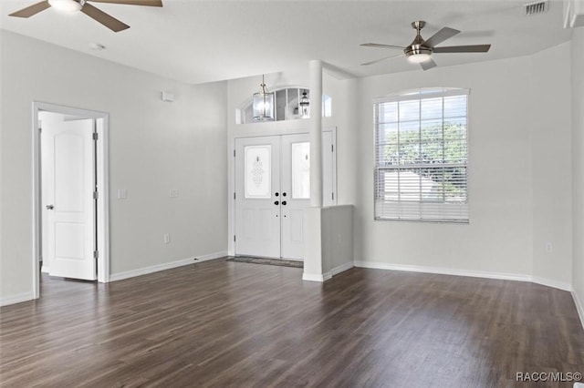 entryway with visible vents, a ceiling fan, dark wood finished floors, and baseboards